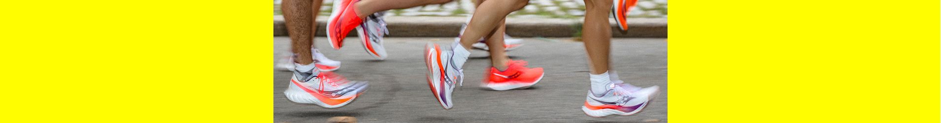A group of running people wearing Saucony Endorphin 4 running shoes.