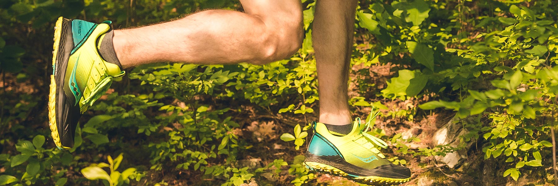 Mad River TR Shoe running with grass and dirt flying behind