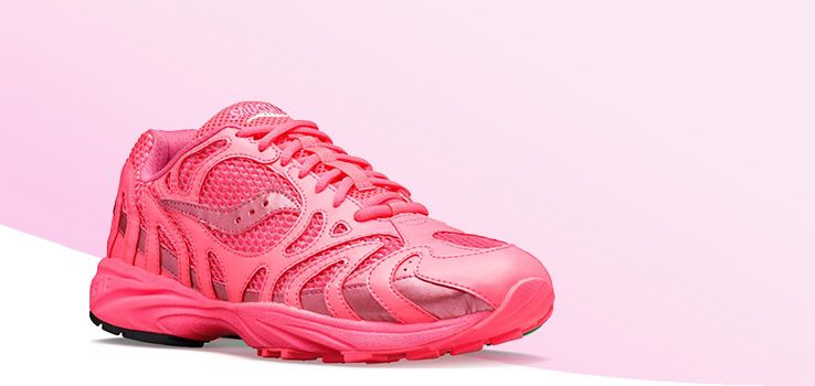 A pink Saucony shoe with a white circle around it.