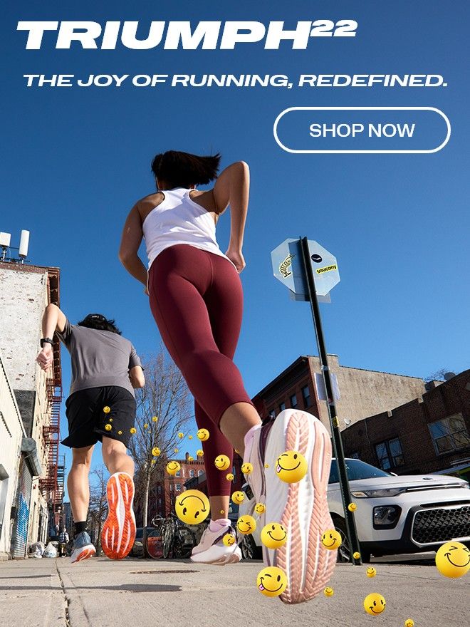 A person running on a street wearing Saucony Triumph 22 shoes.