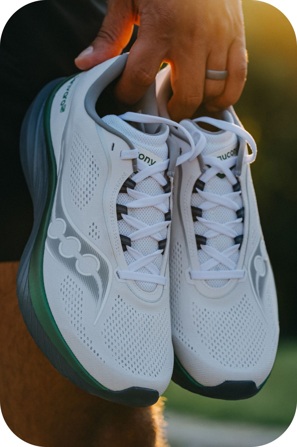 a pair of running shoes on a metal pole
