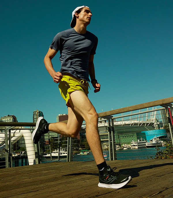 Someone wearing Saucony shoes.