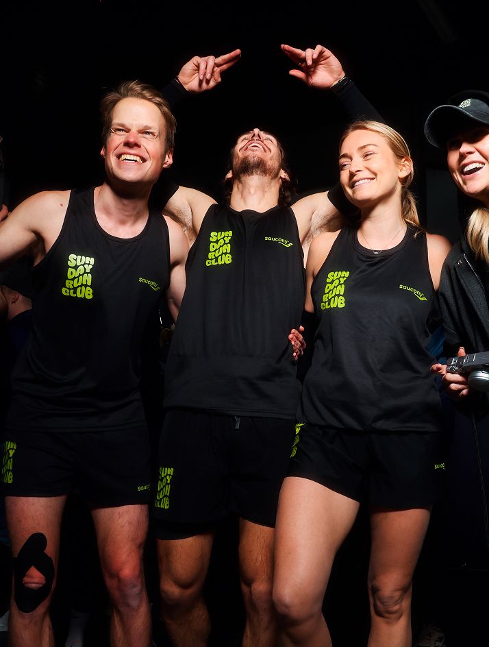 a group of people in black shirts