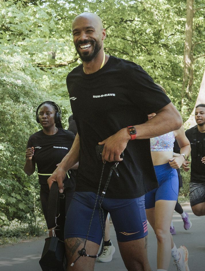 group of runners in blue shorts running