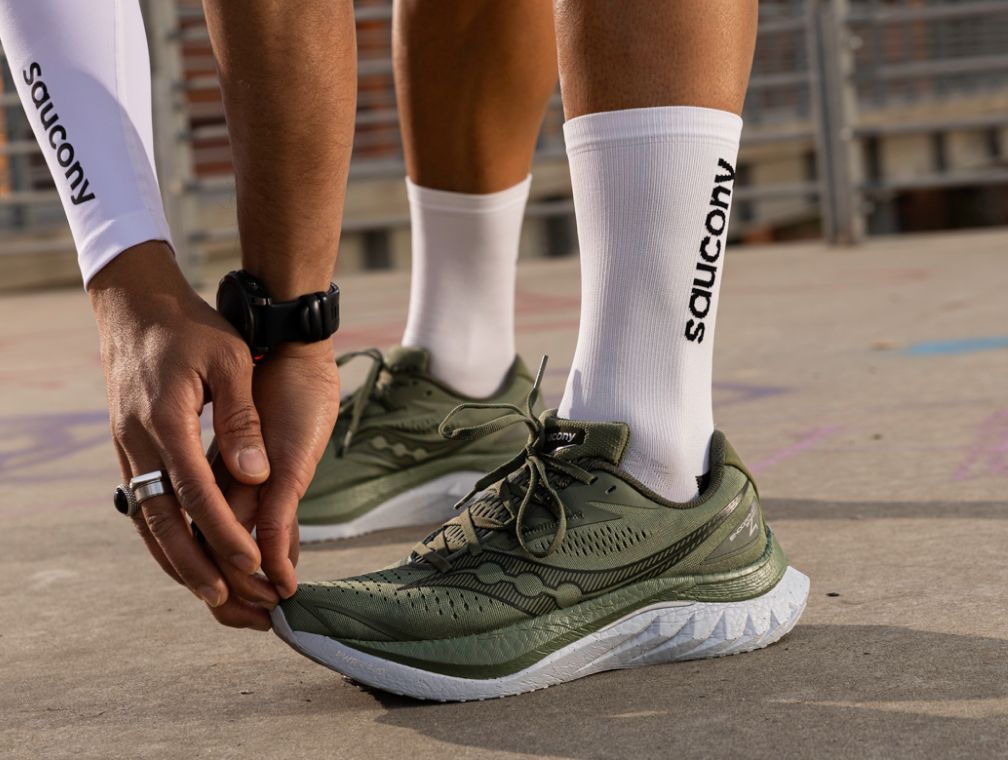 People outside coffee shop wearing Ride 18 shoes