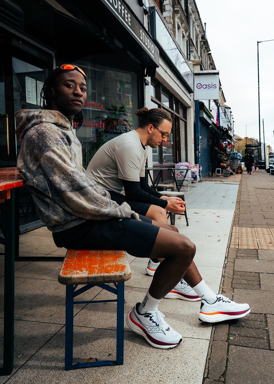 Two people sitting on a bench