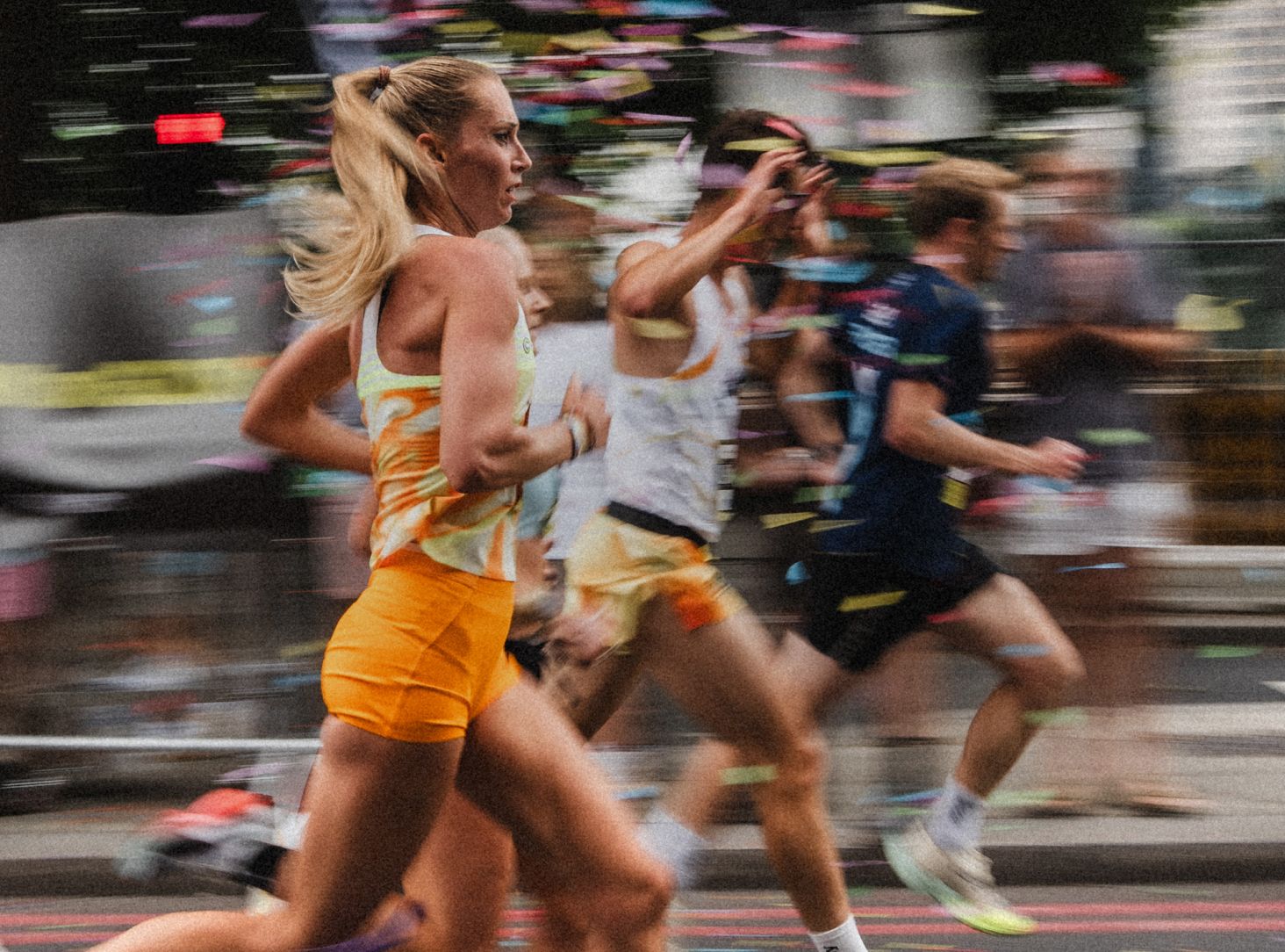 a group of men in running uniforms