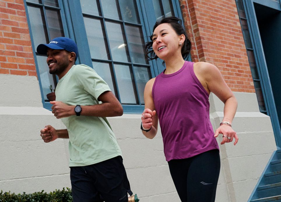 a man and woman running