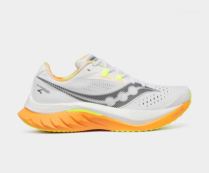 a white shoe with yellow and orange design