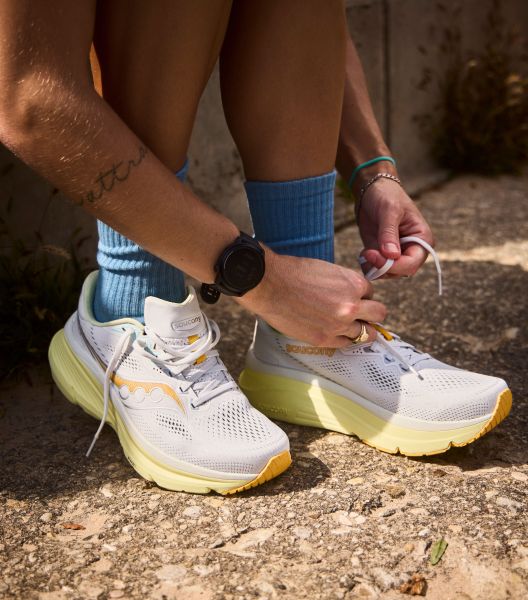 two men running on a sidewalk