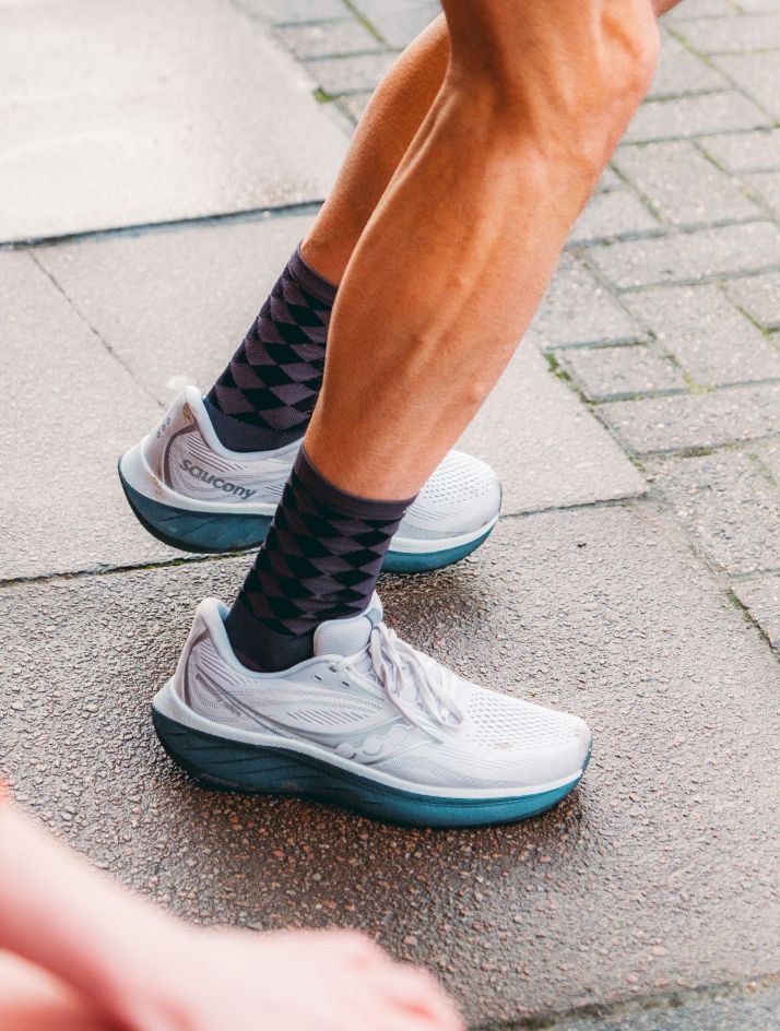 a person's legs and feet in socks