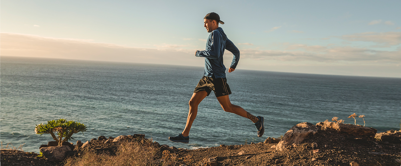 A man running along rocks
