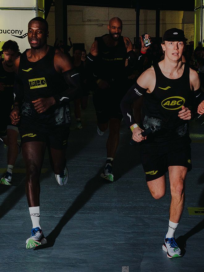 Group of athletes running indoors while wearing Saucony Endorphin shoes during a training session.