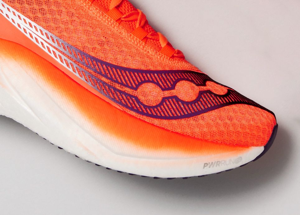 a close up of an orange shoe toe box