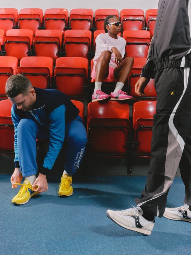 One child and two adults in a gym