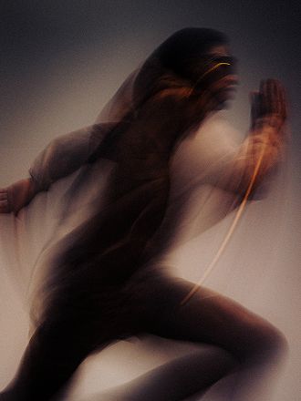 blurry image of a man running