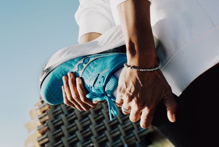 a person holding a shoe