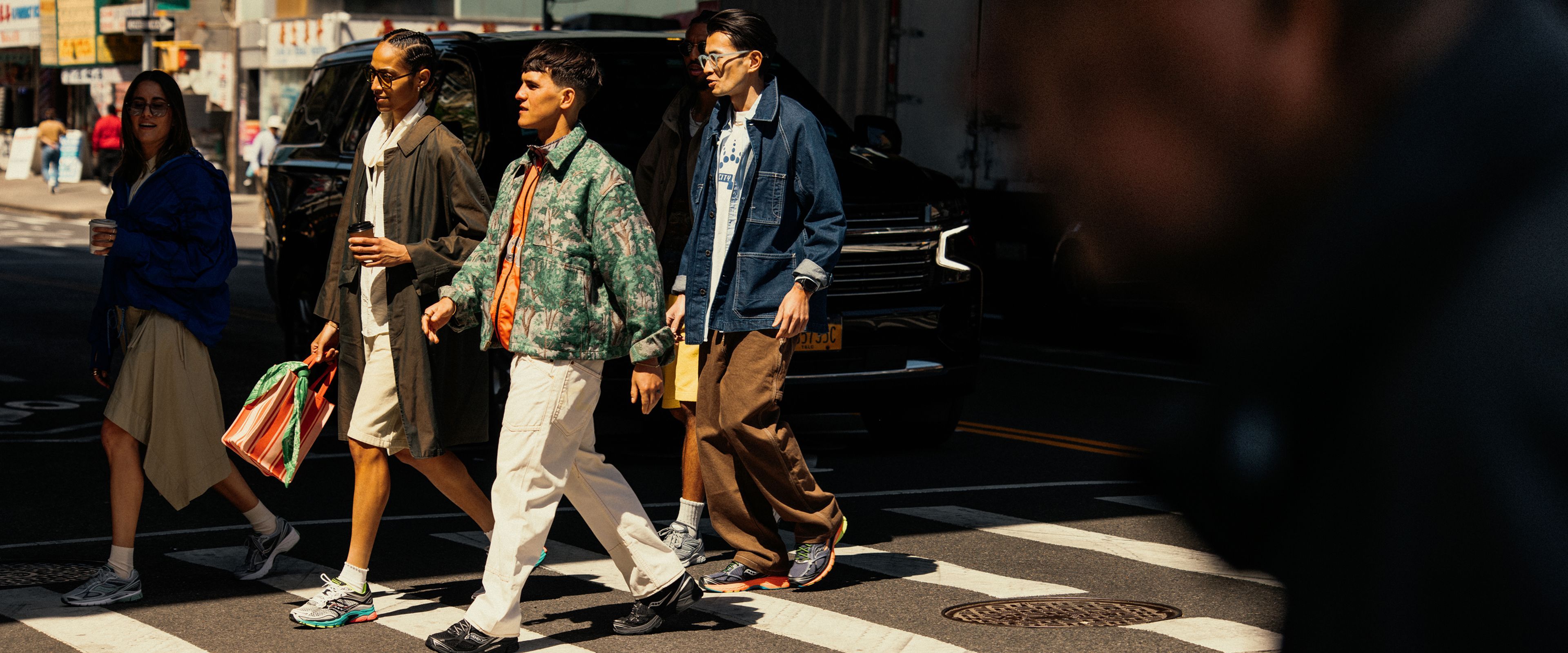 People out shopping wearing Saucony shoes.