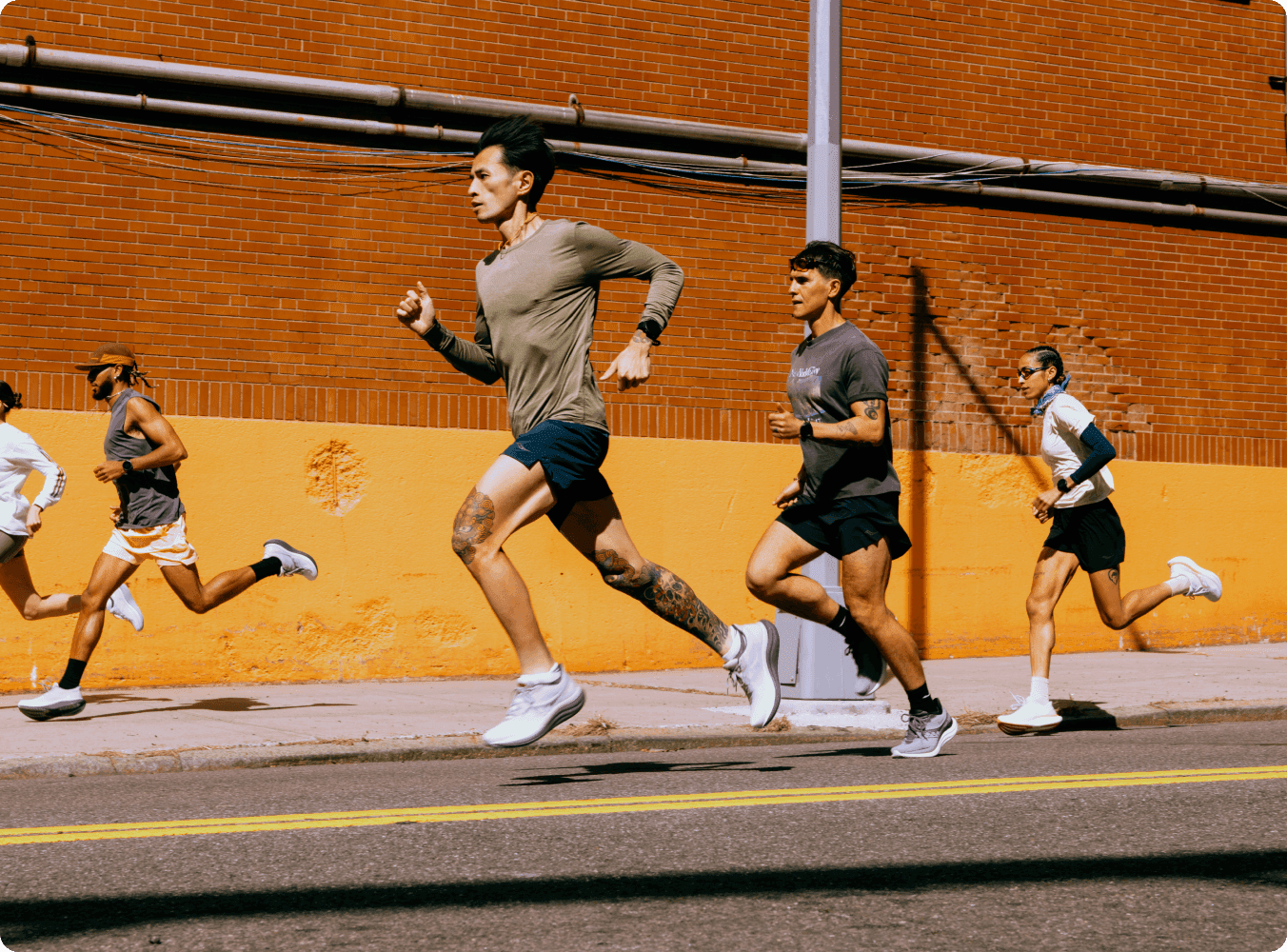 People running wearing Saucony shoes.