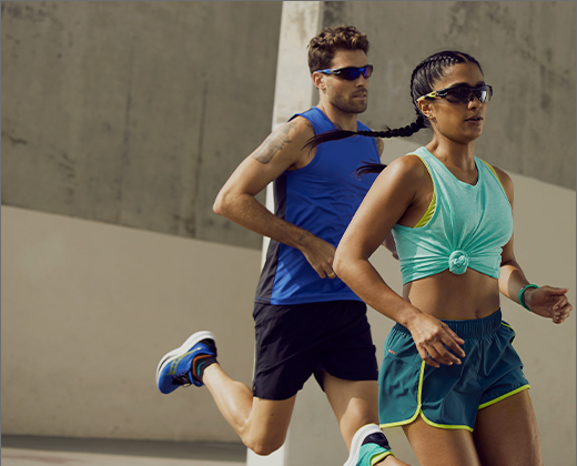 Runners in sunglasses on city streets.