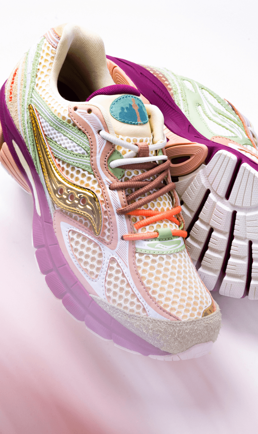 Saucony x Stan Birch ProGrid Guide 7 in cream, sage green and burgundy with metallic gold accents.