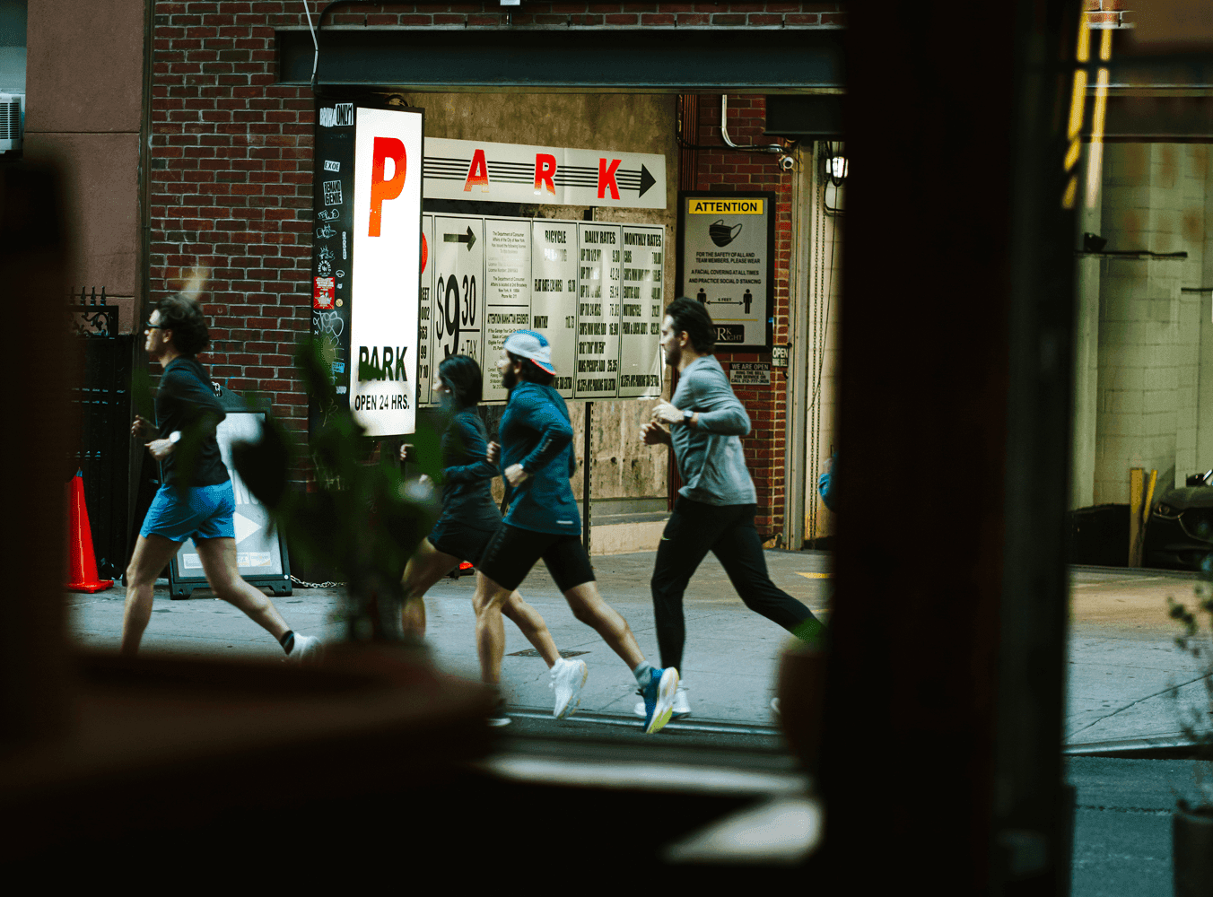 People running wearing Saucony shoes.