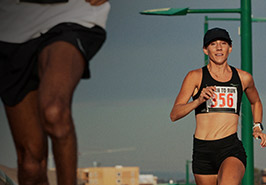 Runners on a city street.