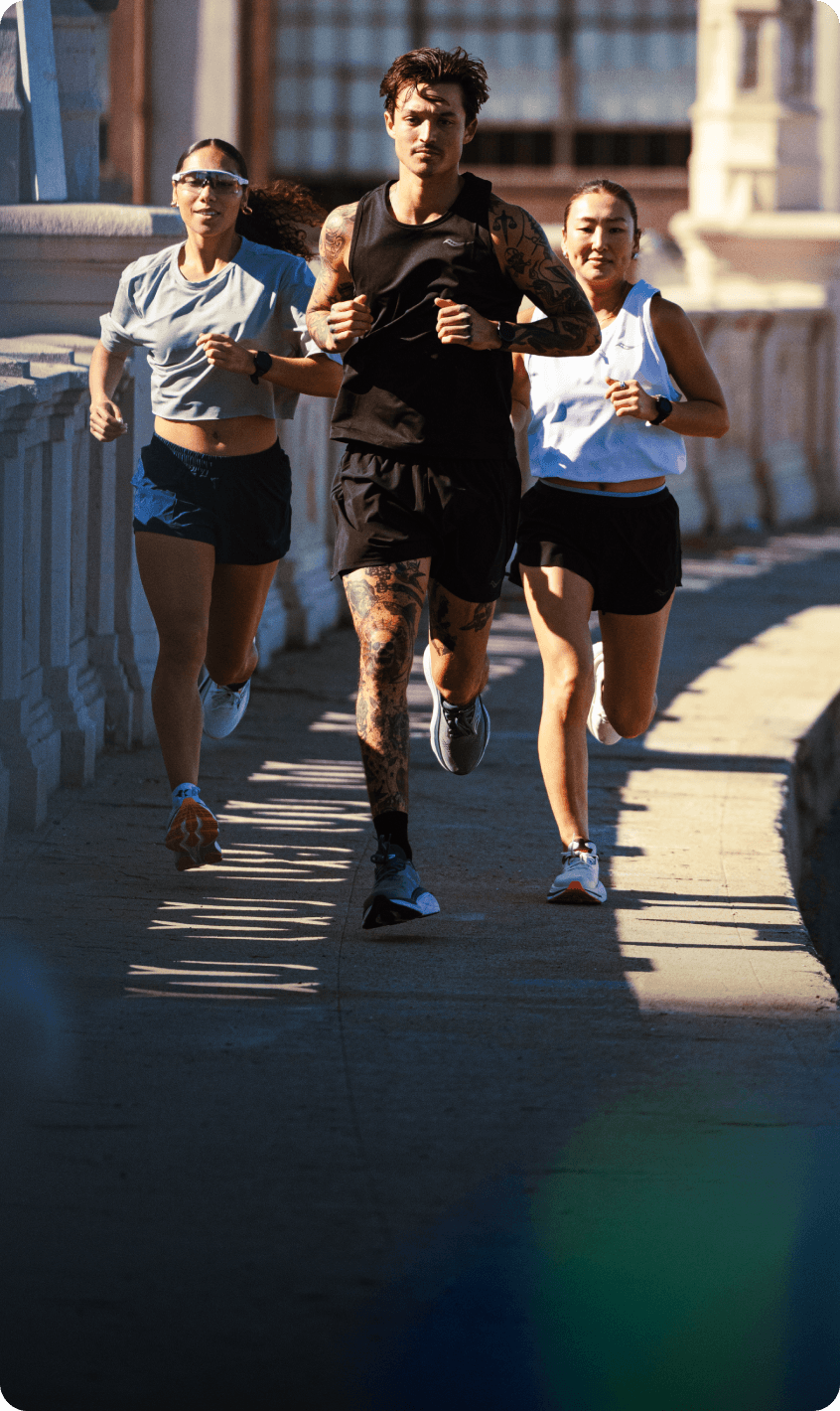 Three runners training together for a marathon.