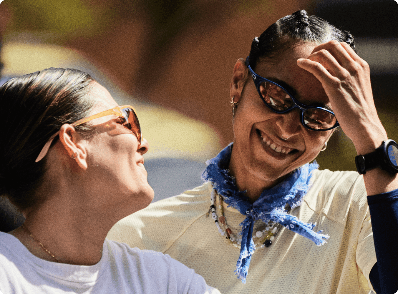 Two people talking and smiling.