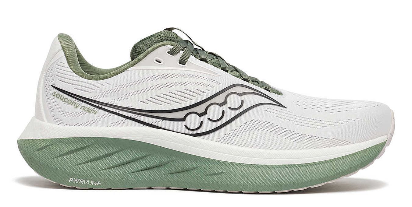A white Saucony shoe with green accents.