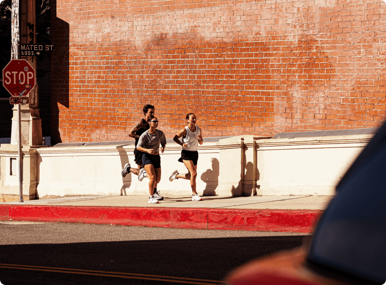 A runner training along a city street.