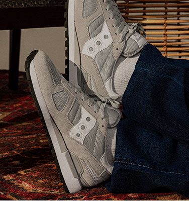 Relaxing while wearing white and grey Shadow sneakers.
