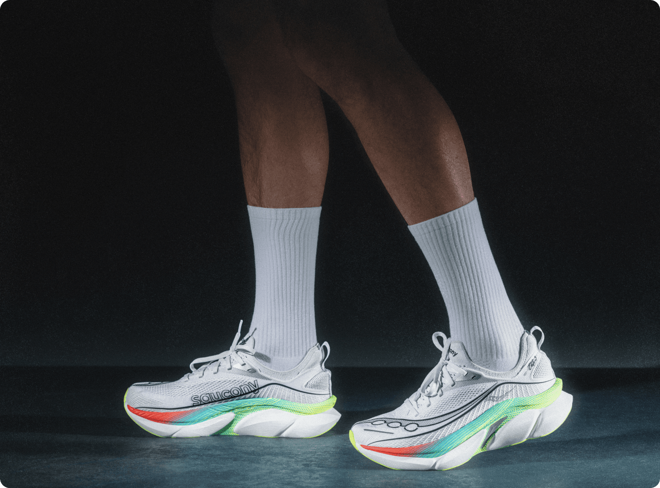 A person wearing Saucony Elite shoes.