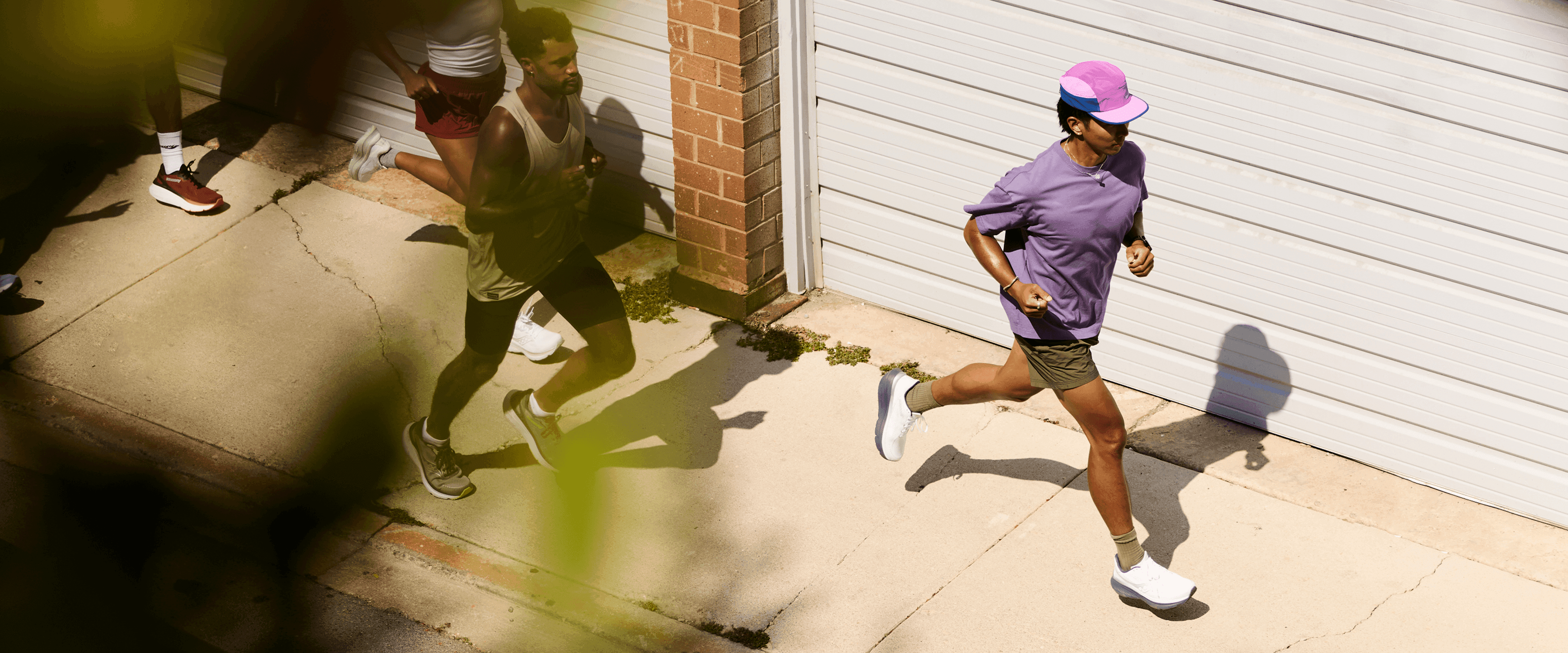 A person running wearing Saucony shoes.