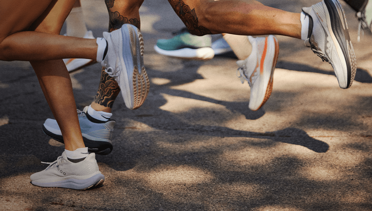 People running while wearing Saucony shoes