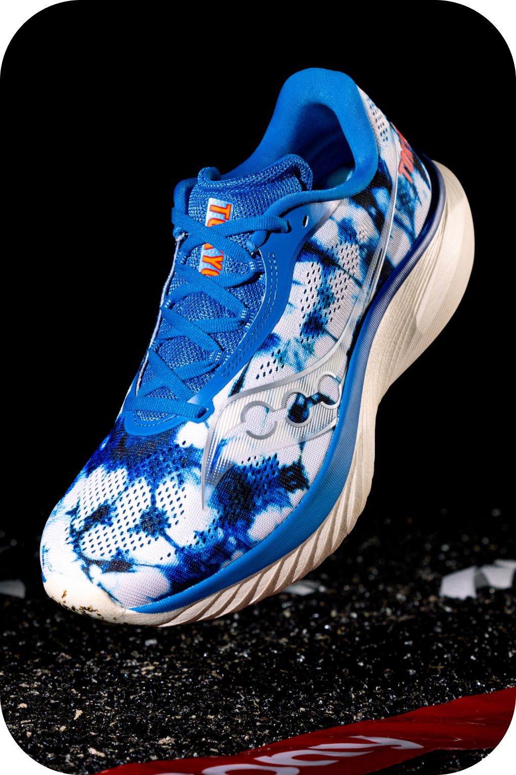 a pair of running shoes on a metal pole