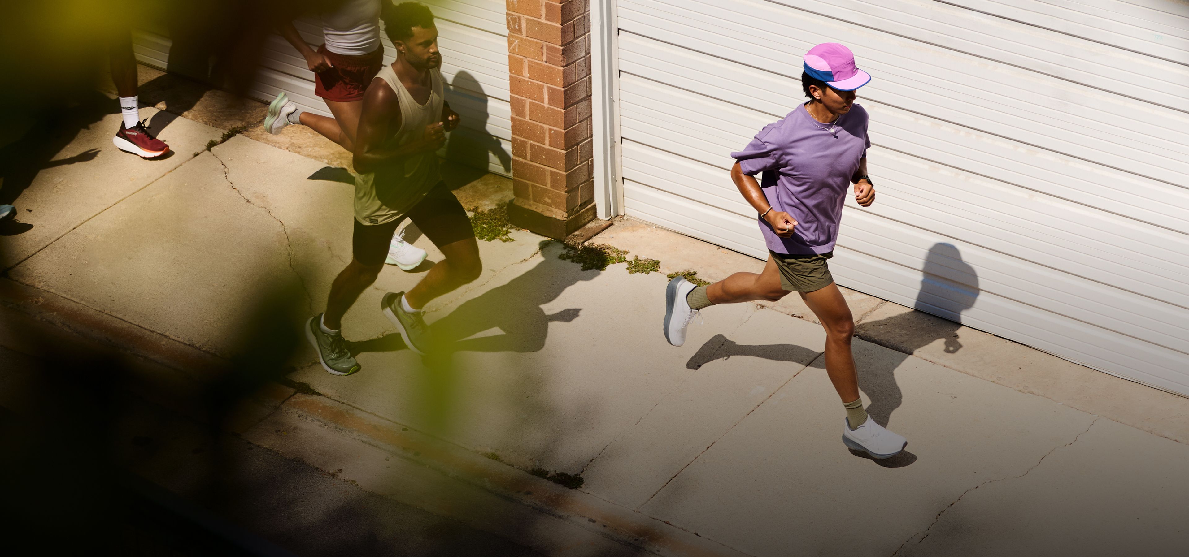 People running wearing Saucony shoes