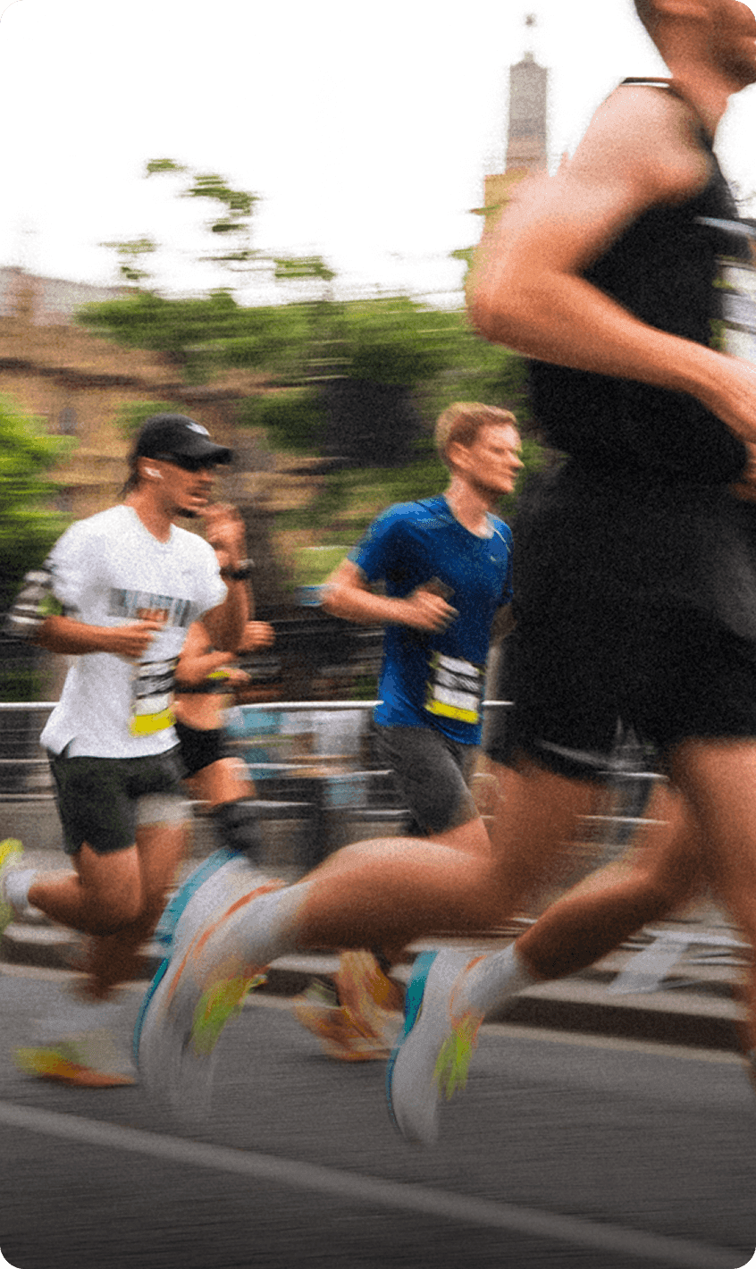 People running wearing Saucony shoes