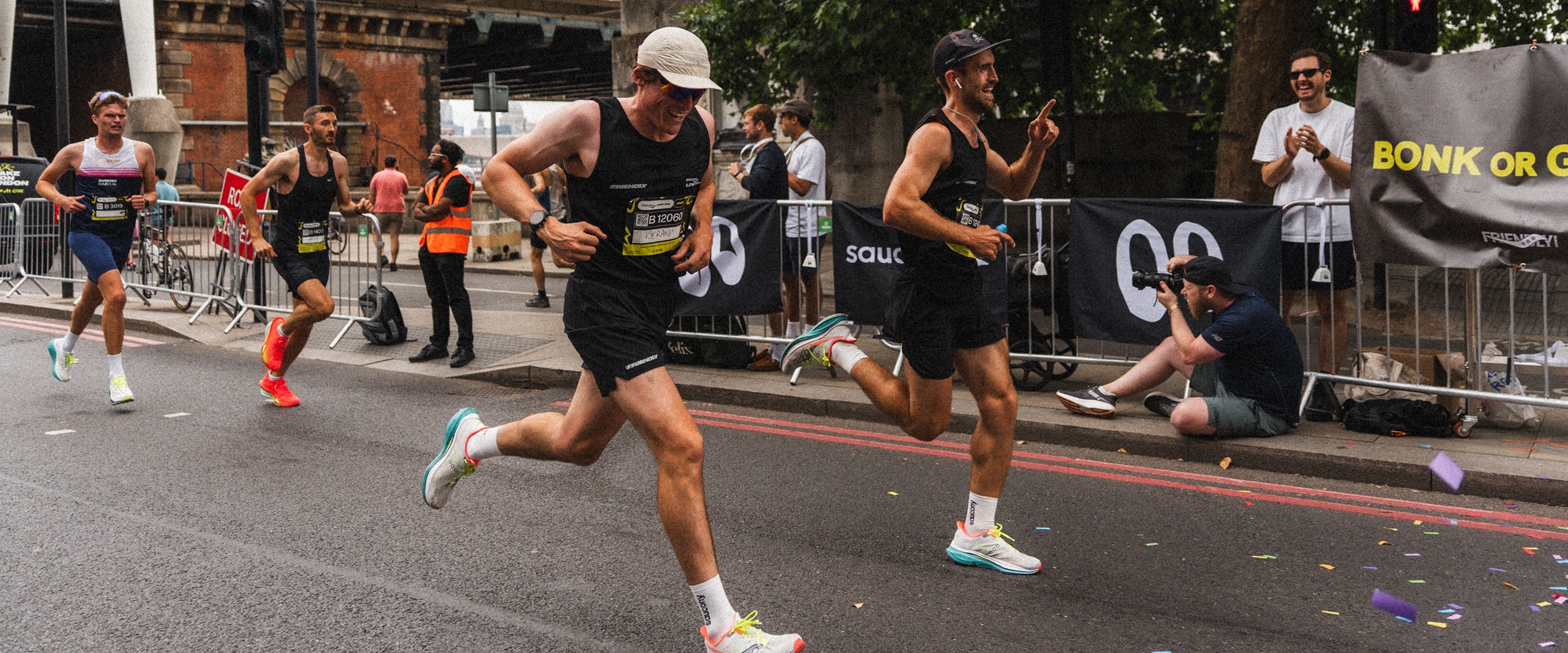 People wearing Saucony gear finishing a race