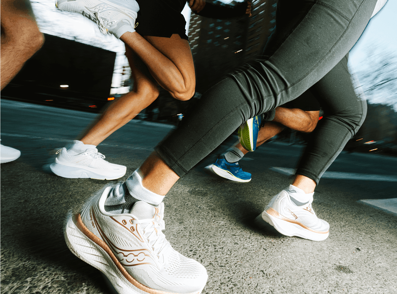 A person wearing Saucony shoes.