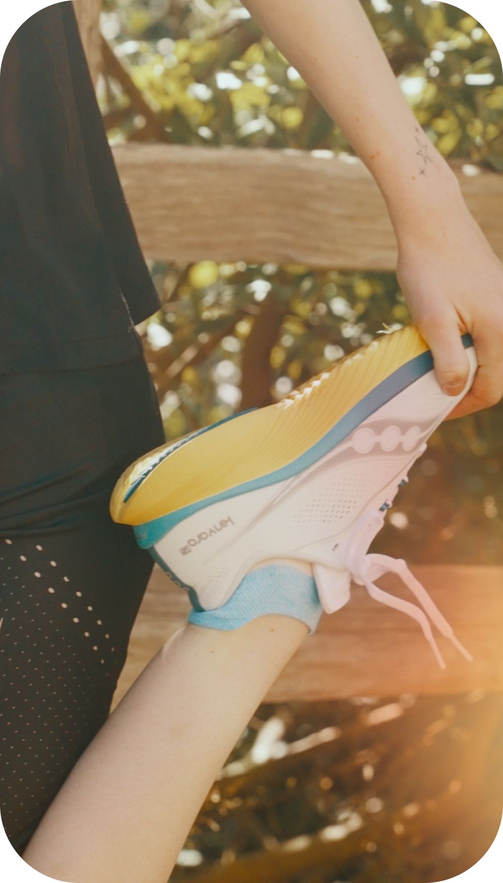 a pair of running shoes on a metal pole